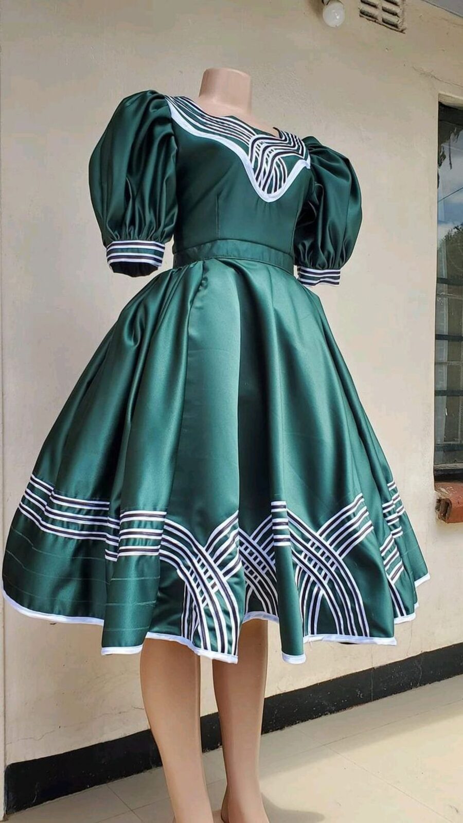 Green satin misisi attire tailored by Clasian
